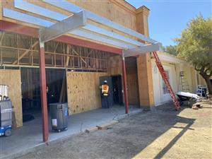 Construction crews work on the new entry.